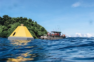 NOAA and partners launch a new buoy in Fagatele Bay to monitor changes in ocean chemistry